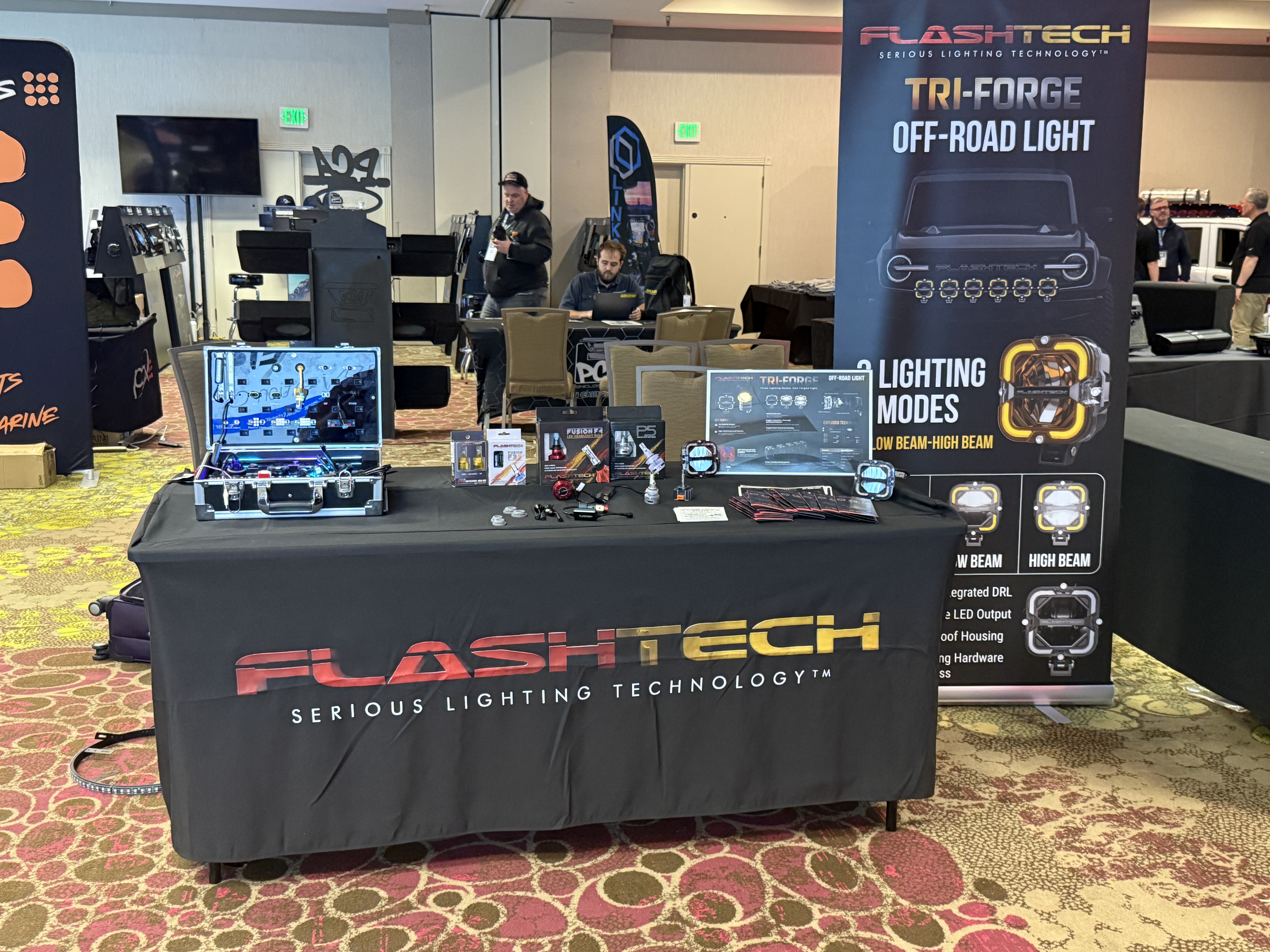 Flashtech booth at PNWCEE 2025 unveiling the TRI-FORGE light