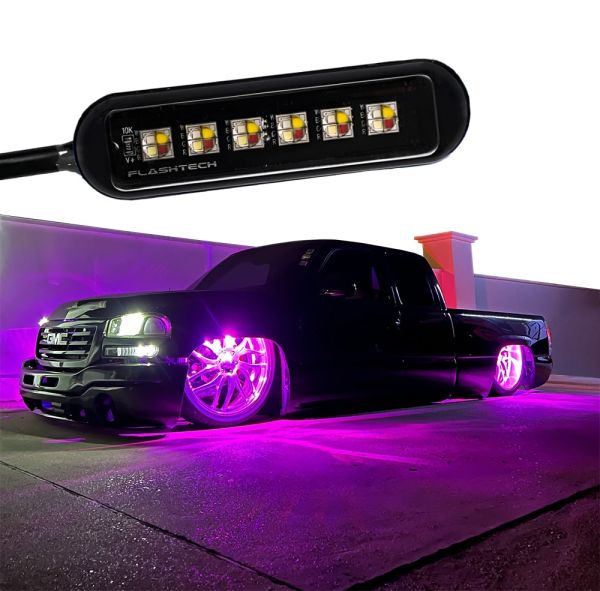 Flashtech RGBW LED Wheel Well Light – Close-up of the LED strip and a black GMC truck illuminated with vibrant purple underglow lighting, showcasing the powerful and customizable lighting effect.
