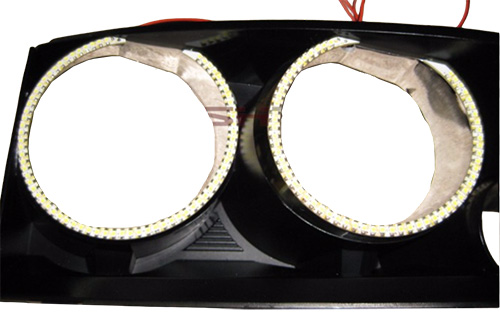 Original LED halo rings on a 2008 Dodge Charger headlight housing